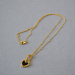 Black and White Heart Pendant Necklace in Gold
