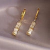 White Opal Bambo Earrings in Gold