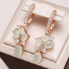 Elegant Earrings with Green Crystals and Zirconia in Gold