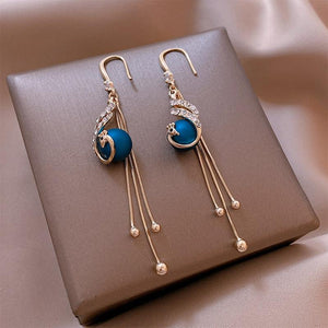 Festive Earrings with Blue Pearls