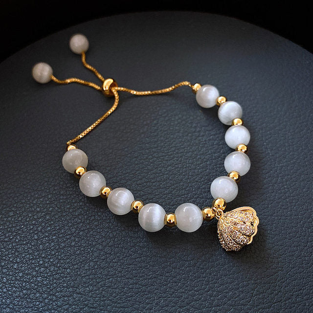Shell Bracelet with Pearls in Gold