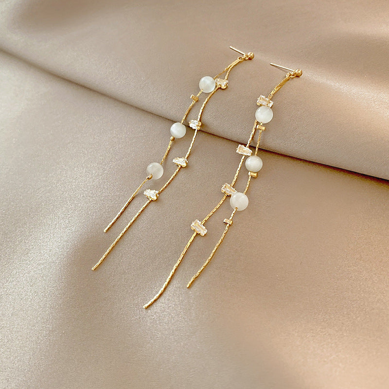 Pearl Dangle Earrings in Gold