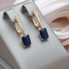 Shiny Earrings with Blue Crystal in Gold